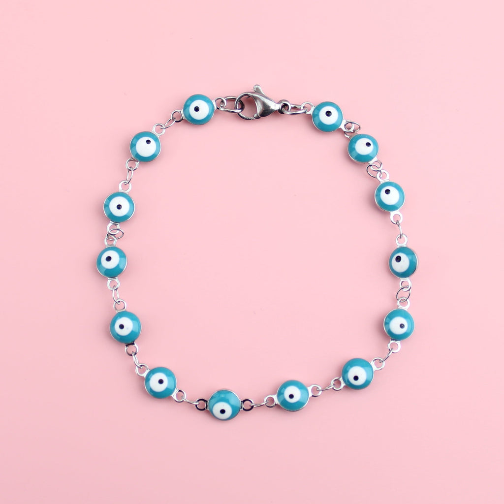 Blue enamelled eyes on a stainless steel bracelet