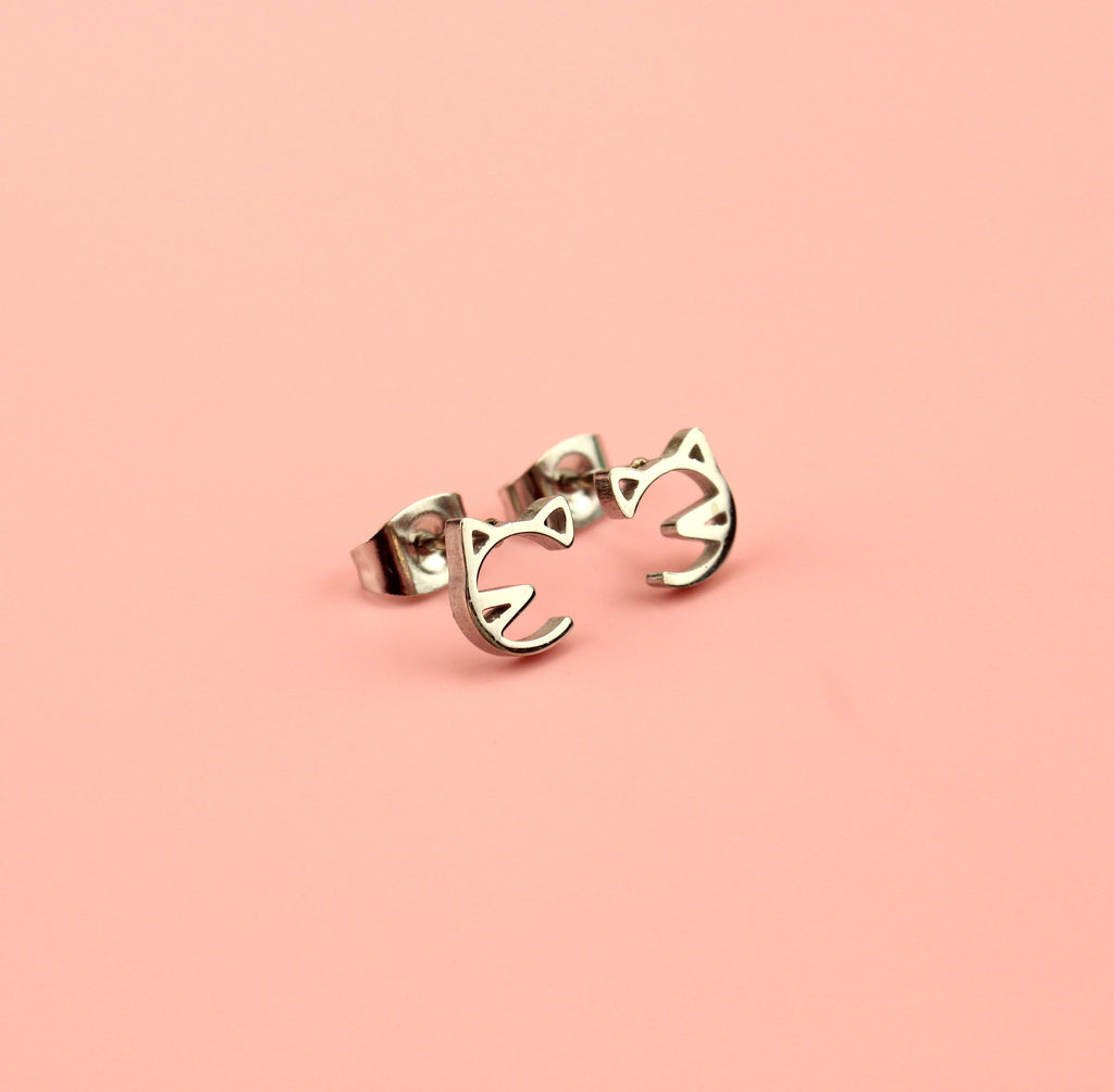 Stainless steel studs with a cut out cat face design
