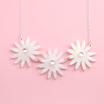 Sterling Silver necklace featuring a trio of acrylic daisies cut from white marble acrylic