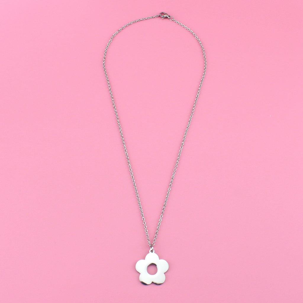 Stainless steel chain featuring flower charm with a cut out middle