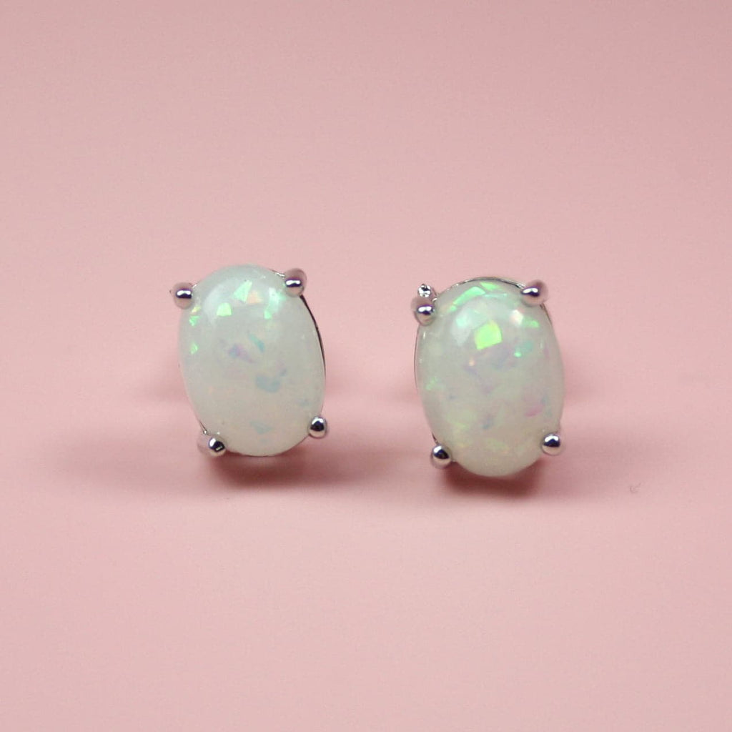 Small faux opal stud earrings with a silver ball on all four corners
