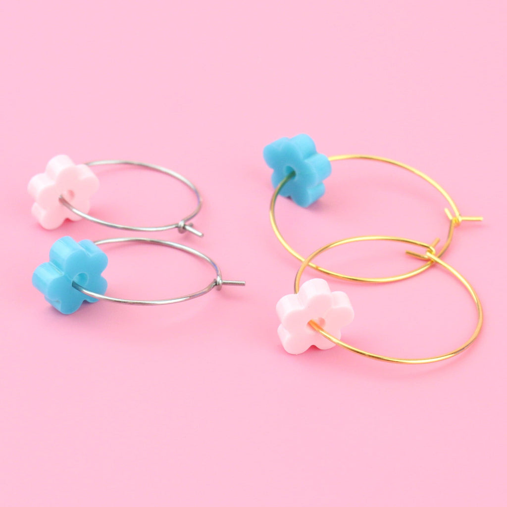 2 pack of hoop earrings - silver hoops with blue acrylic flower charms and gold hoops with baby pink acrylic flower charms