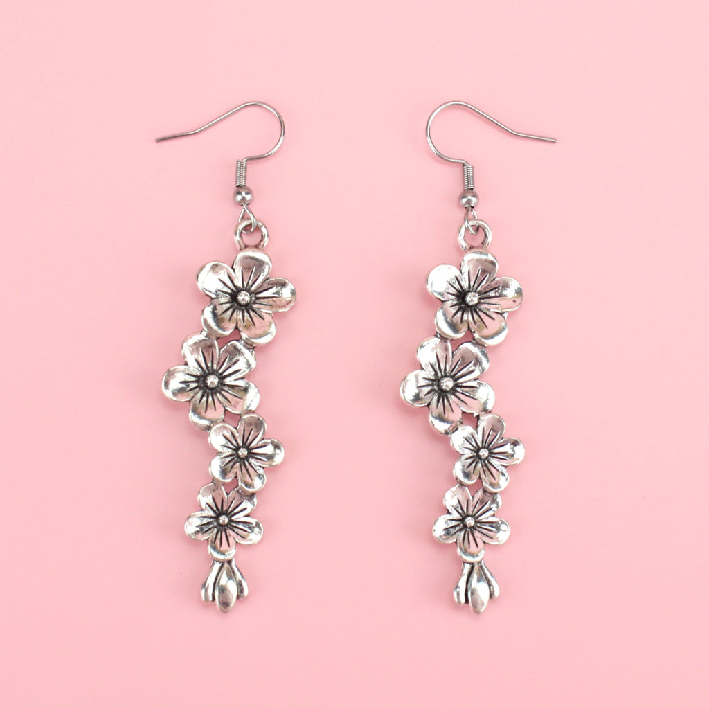 Silver plated hanging flower charms on stainless steel earwires