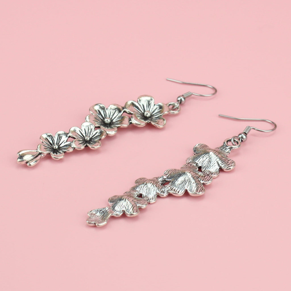 Silver plated hanging flower charms on stainless steel earwires
