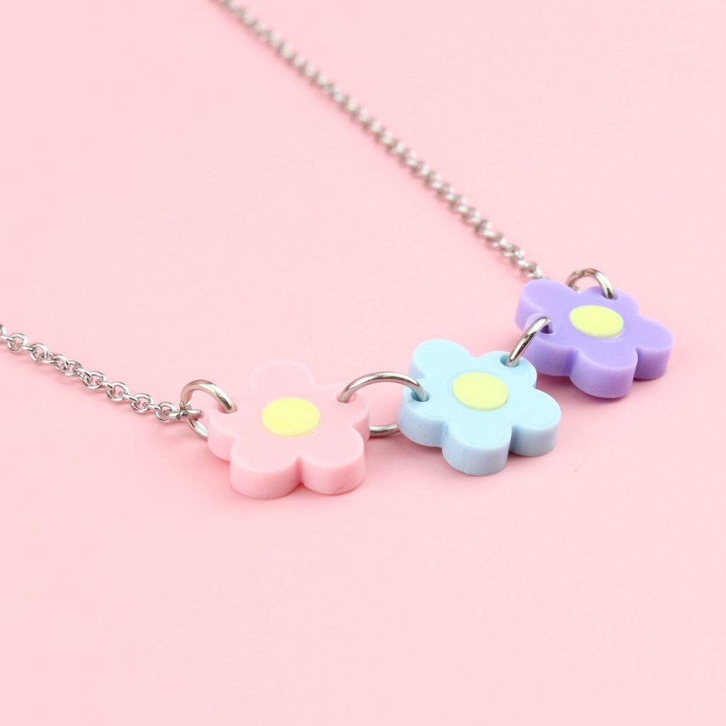 Necklace with Three Flowers in Pink, Blue, Purple all with a yellow centre