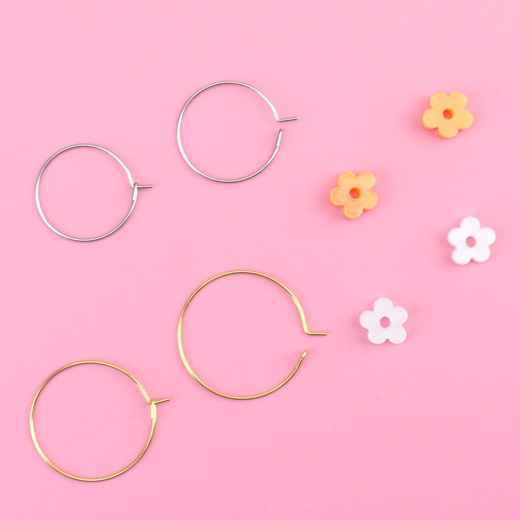 2 pack earring set showing the hoops and flower charms separately