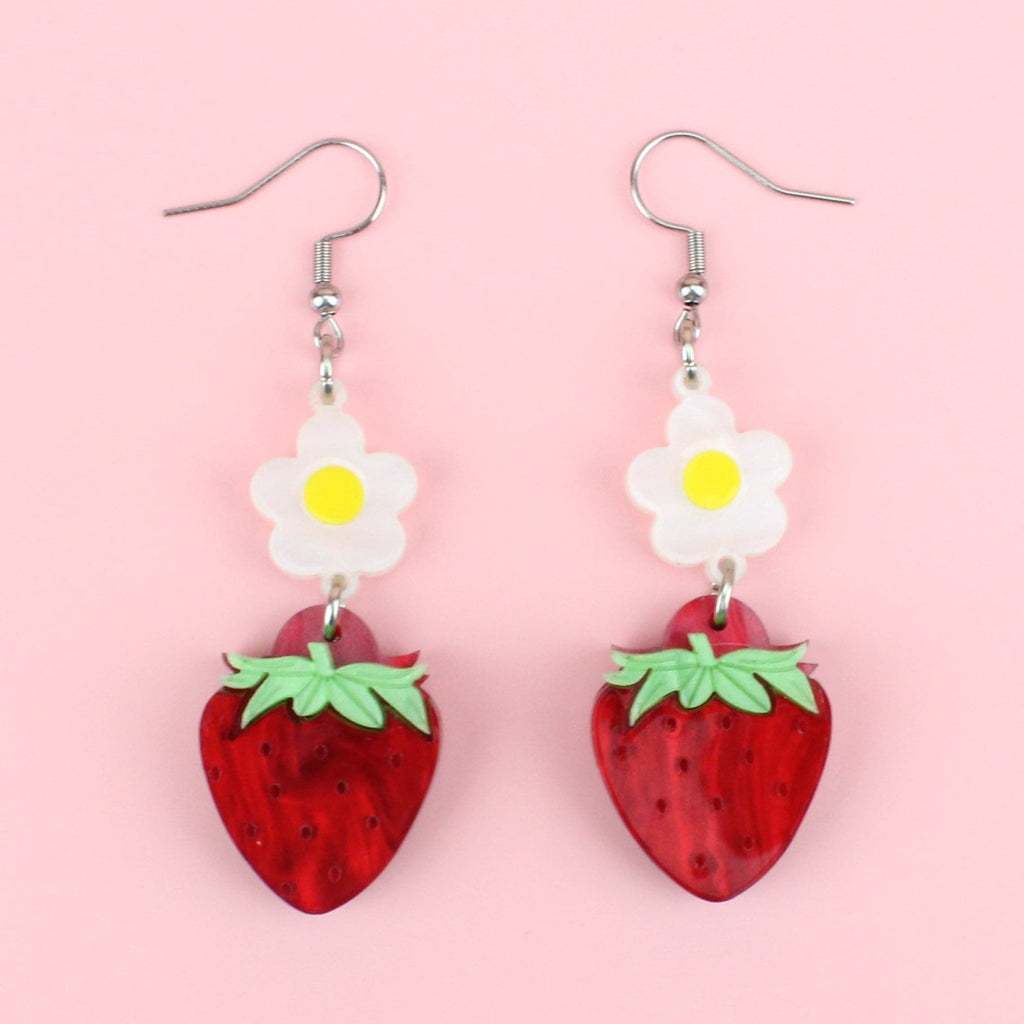 Acrylic strawberries hung from blossom charms on stainless steel earwires