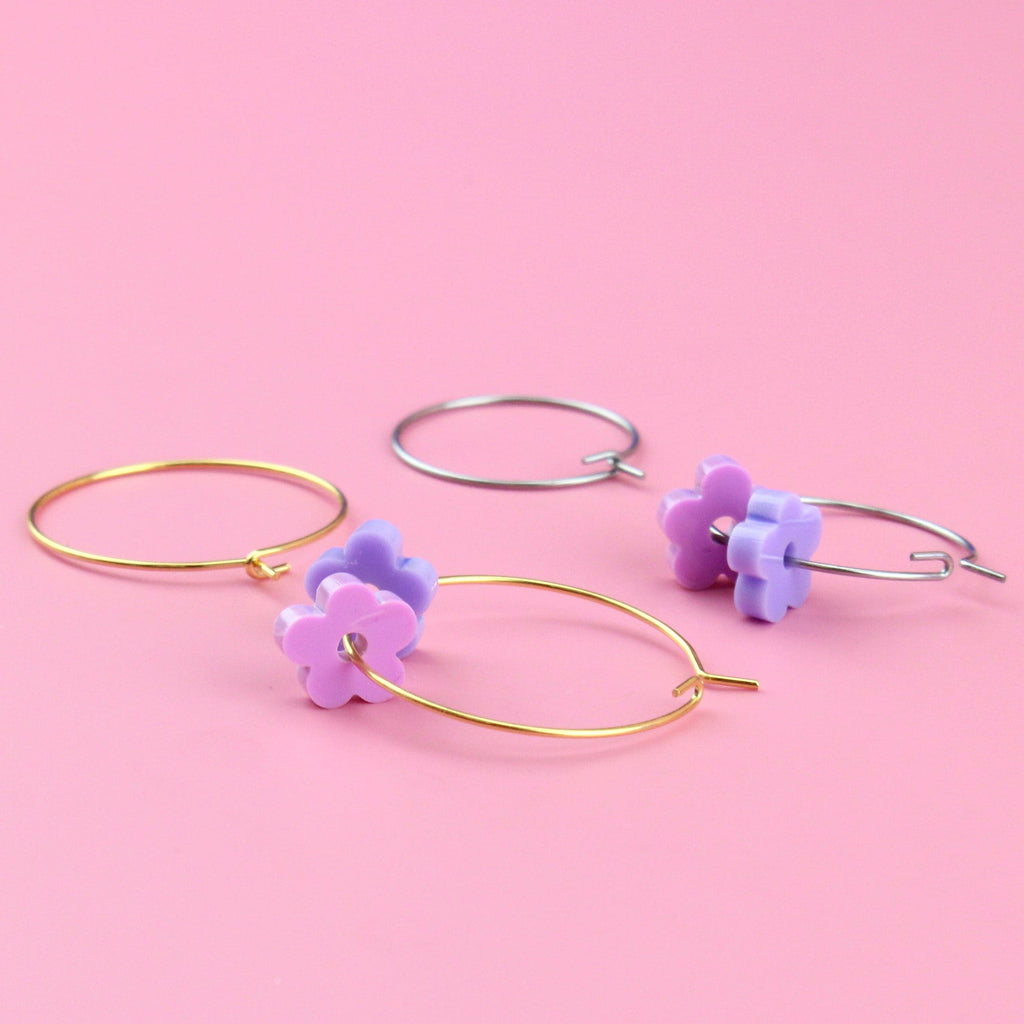 2 pack earring set - silver hoops with purple flower charms and gold hoops with pink flower charms