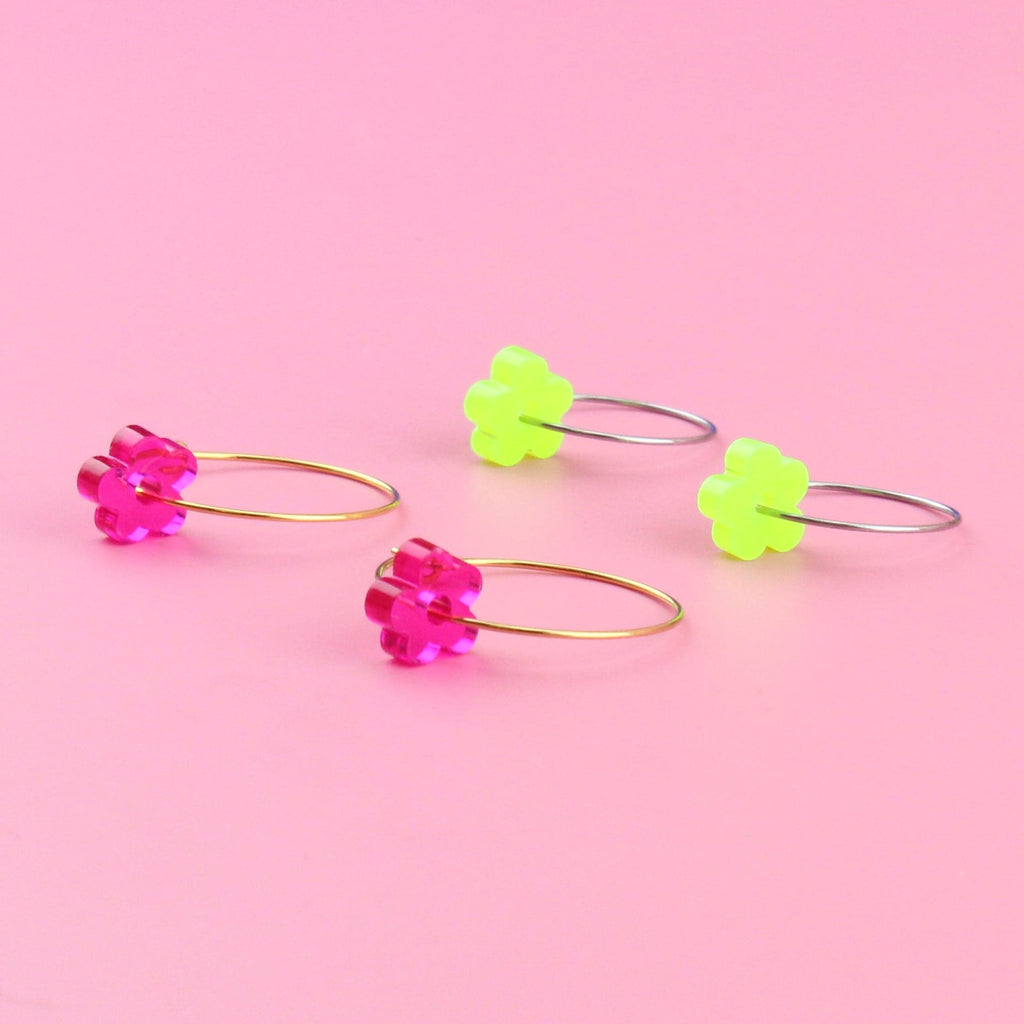 The pink flower charms on gold hoops and green flower charms on silver hoops