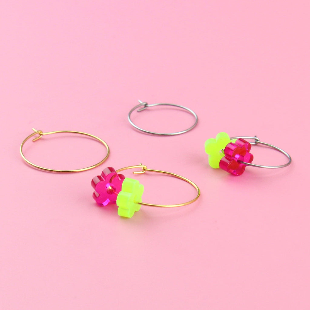 Showing 2 flower charms on one earring