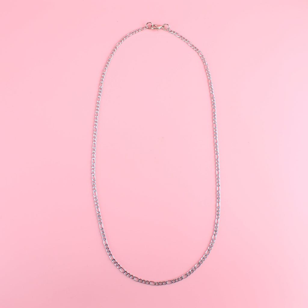 20 inch stainless steel figaro necklace features a pattern of three short links followed by one long link