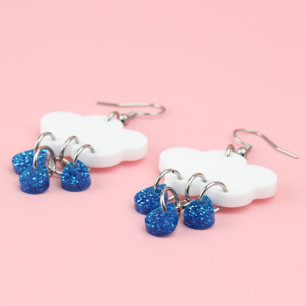 White cloud earrings with blue glitter raindrop charms on stainless steel ear wires