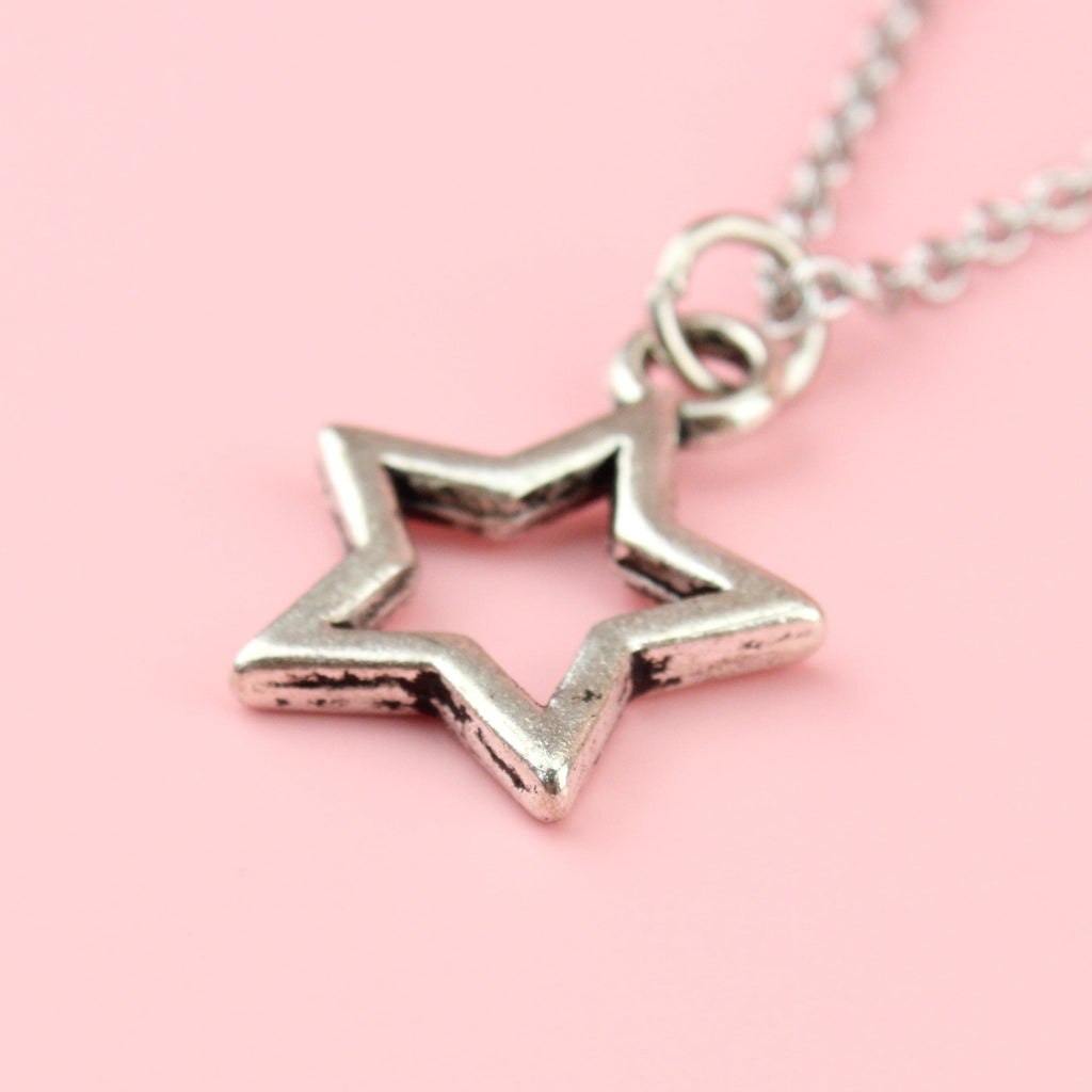 Cut out star pendant on a stainless steel chain