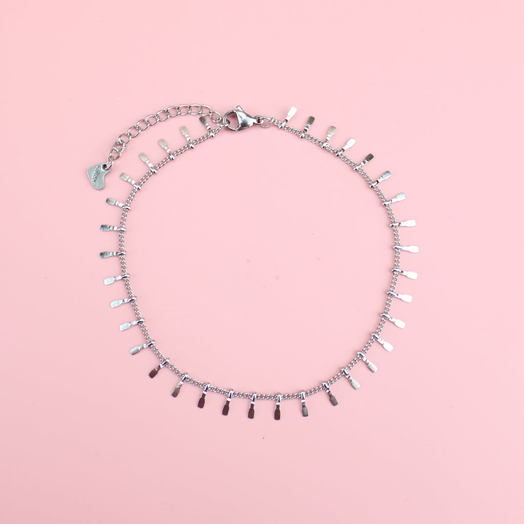 Stainless Steel Anklet featuring individual tassle hammered teeth charms