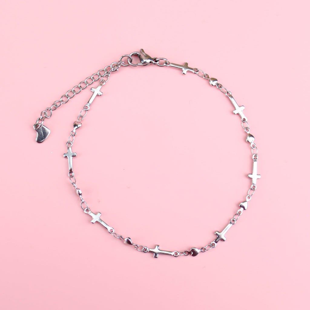 Anklet made up of charms with the cross symbol on them