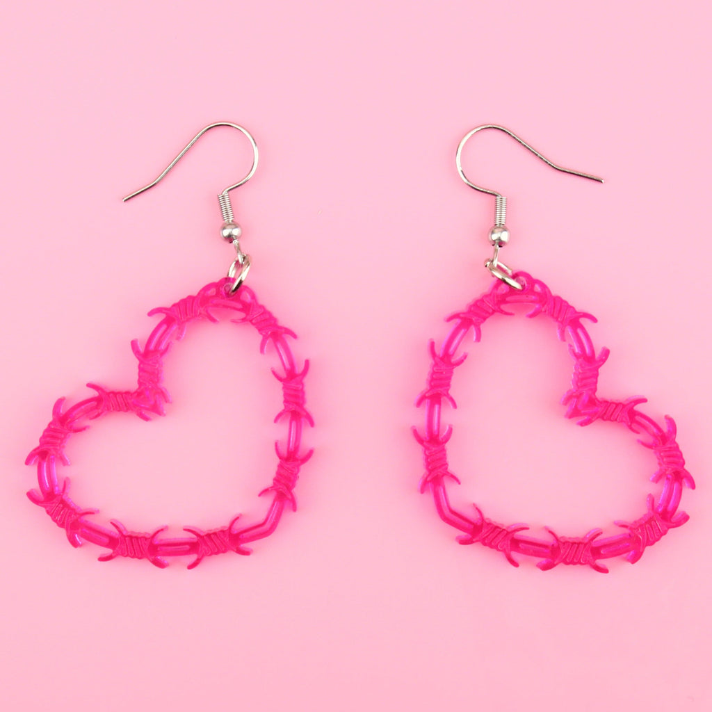 Pink barbed wire style heart shaped earrings on stainless steel earwires