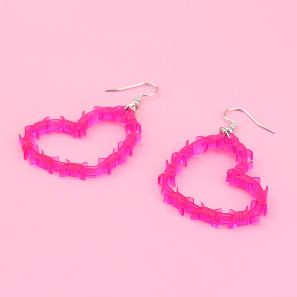 Pink barbed wire style heart shaped earrings on stainless steel earwires