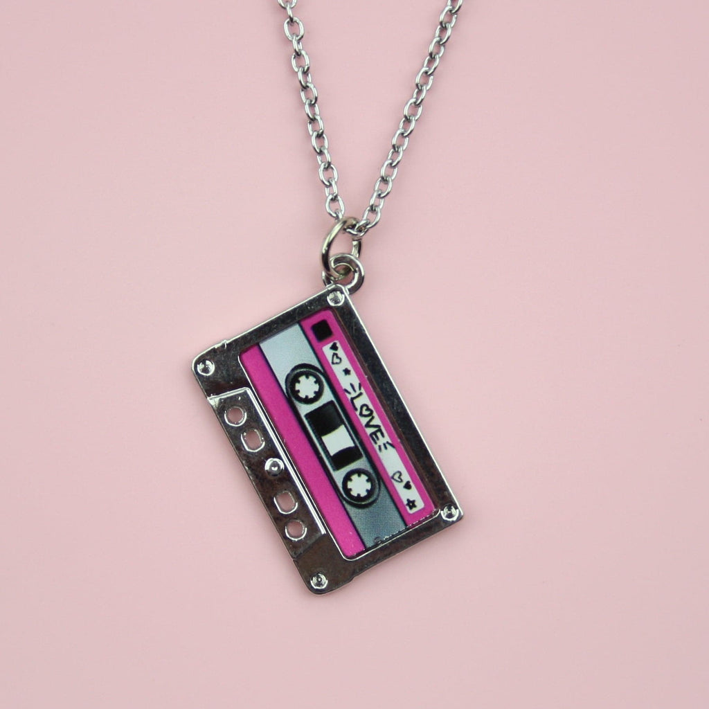 Stainess steel chain with a pendant featuring a mix tape titled the word 'love' surrounded by hearts, the top and bottom of the mix tape is pink