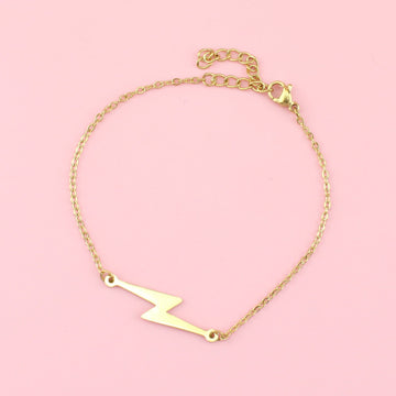 Gold plated stainless steel bracelet featuring a lightning bolt charm