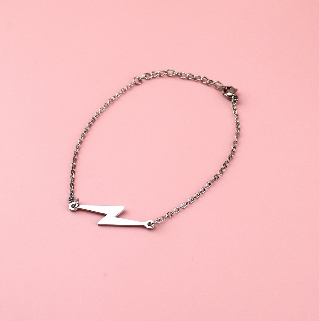 Stainless steel bracelet with lightning bolt charm