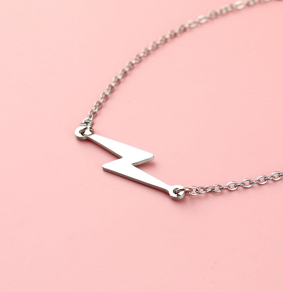 Stainless steel bracelet with lightning bolt charm