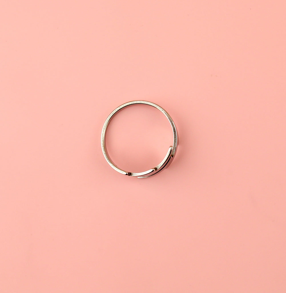 Stainless steel Loop dee loop style ring featuring lightning bolts at the front