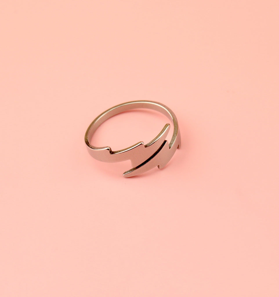 Stainless steel Loop dee loop style ring featuring lightning bolts at the front