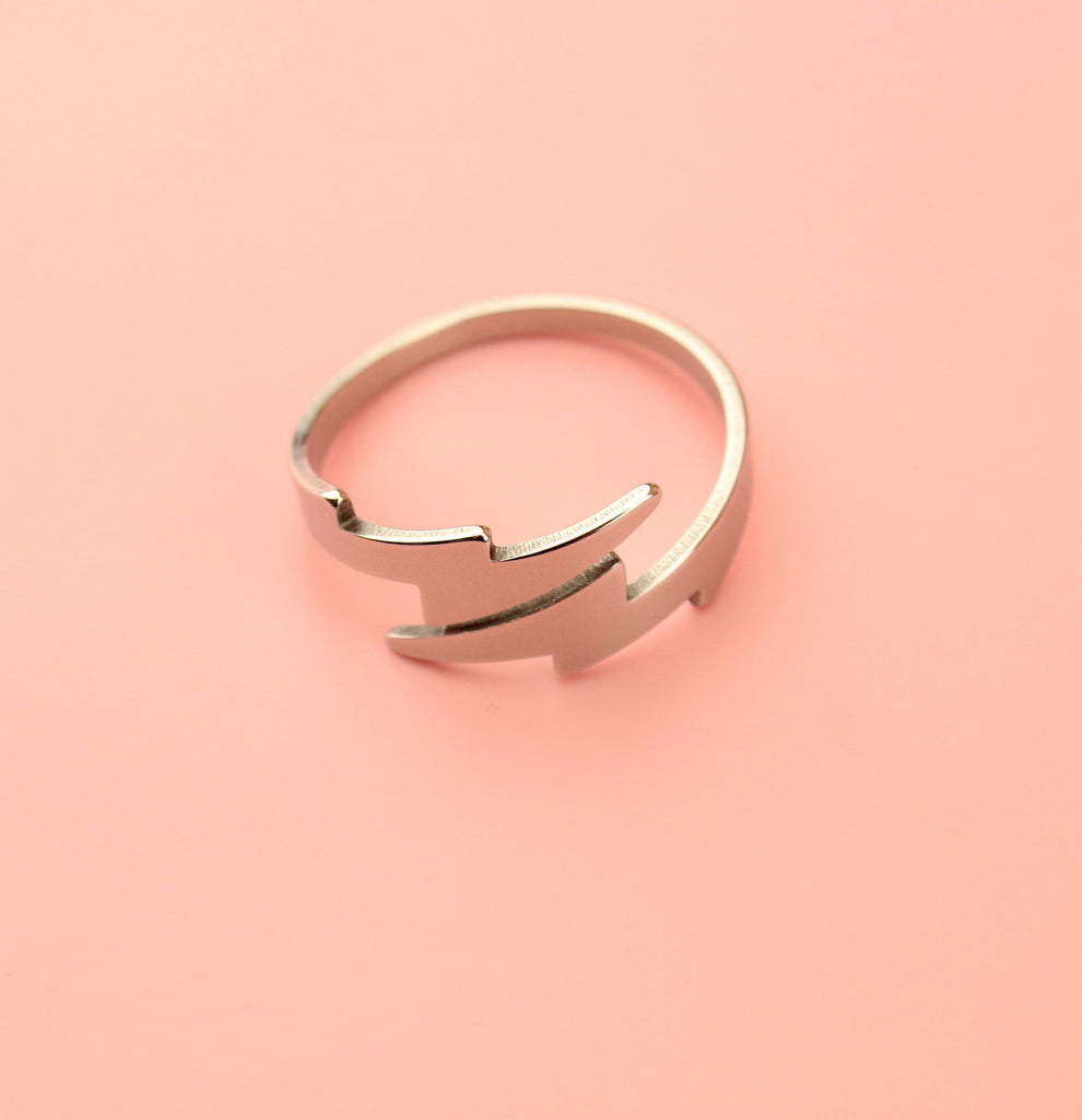 Stainless steel Loop dee loop style ring featuring lightning bolts at the front