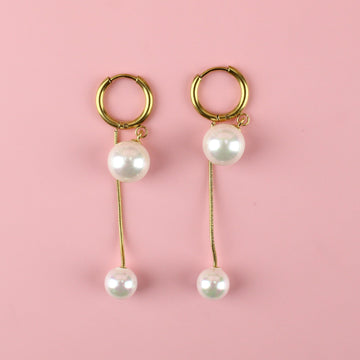 Gold plated drop earrings with a large pearl at the top and small pearl at the bottom