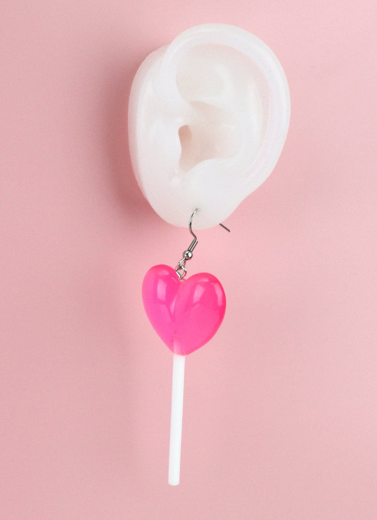 Ear showing Pink Heart Lollipop Earrings