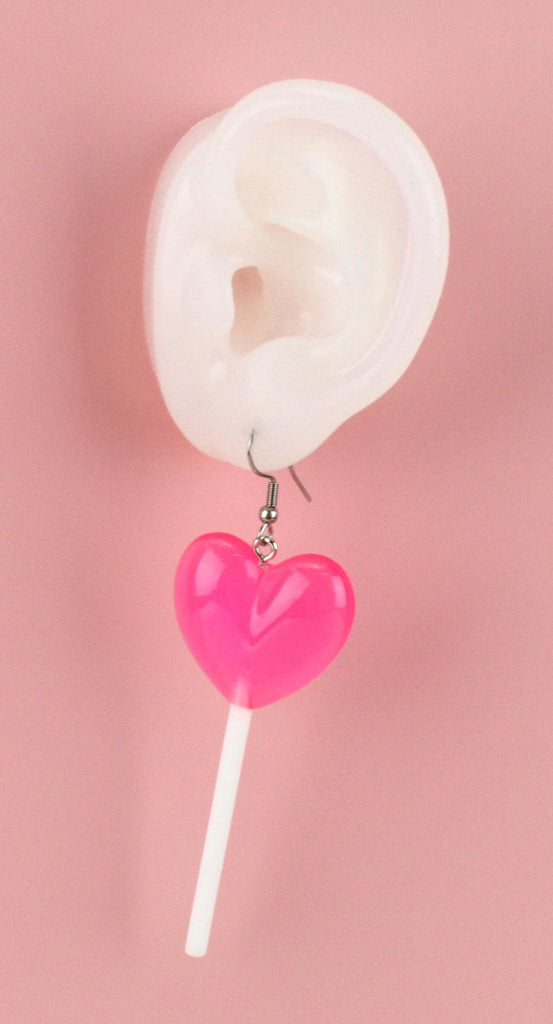 Ear showing Pink Heart Lollipop Earrings