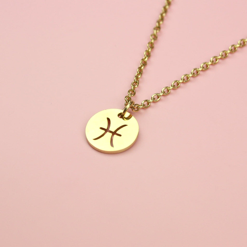Gold plated stainless steel necklace featuring a gold circular pendant with the Pisces symbol