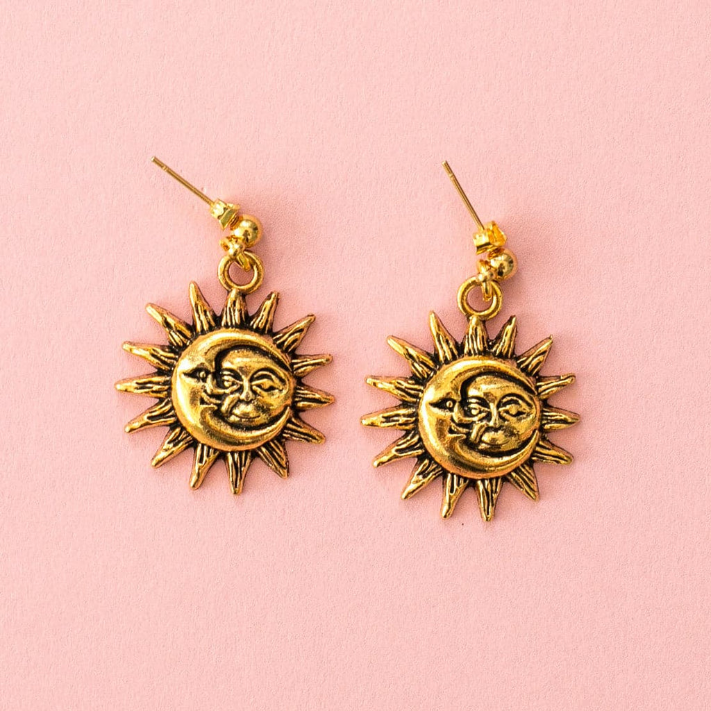 Charms with Moon and Sun Faces with a sun outline on gold plated stainless steel studs