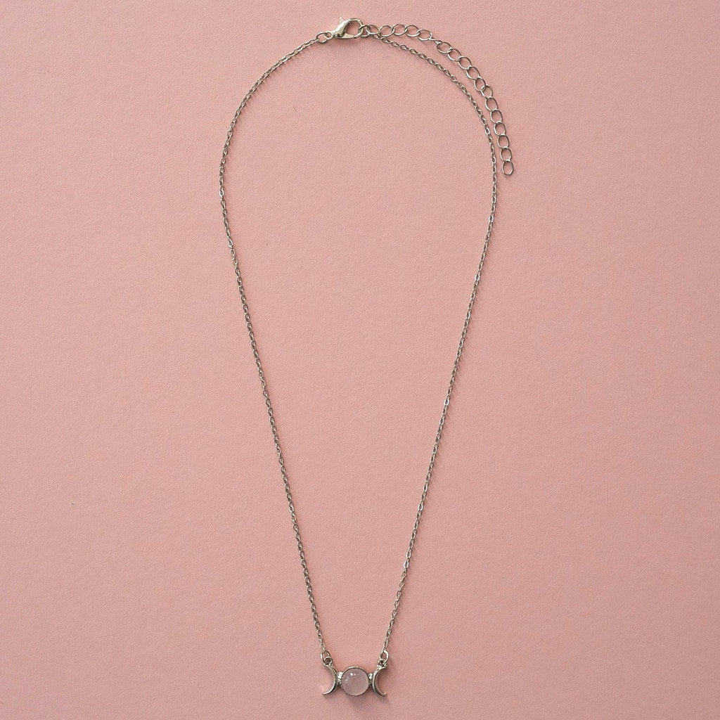 Base Metal Necklace featuring a rose quartz pendant with 2 moons either side of it