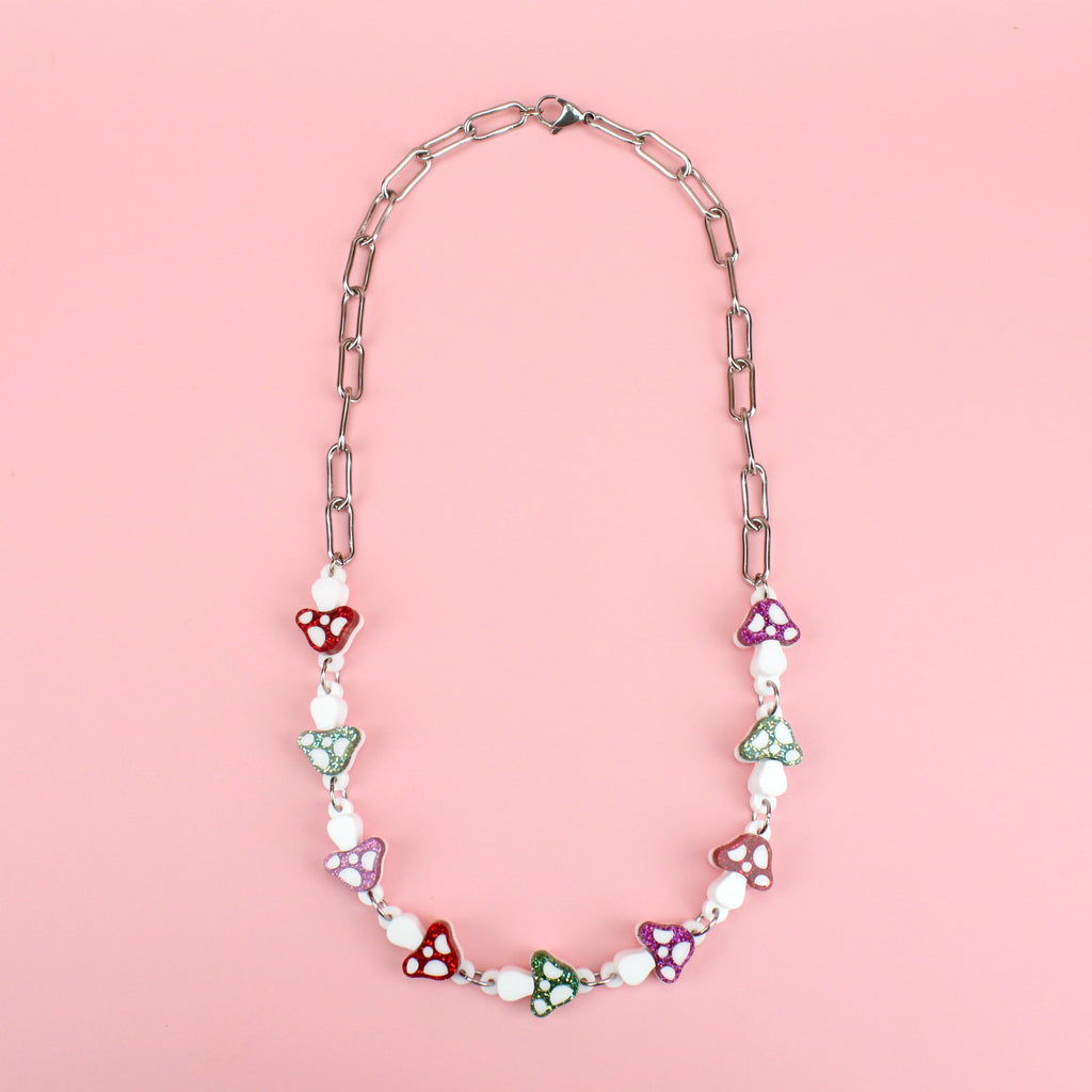 Oval chain necklace with red, green and pink glittery mushroom charms 