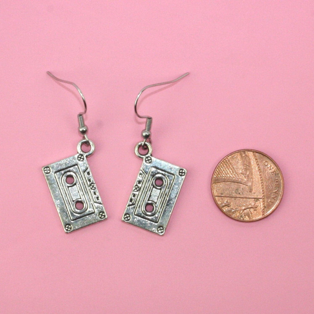 Silver plated tape charms on stainless steel earwires with a penny next to it for scale