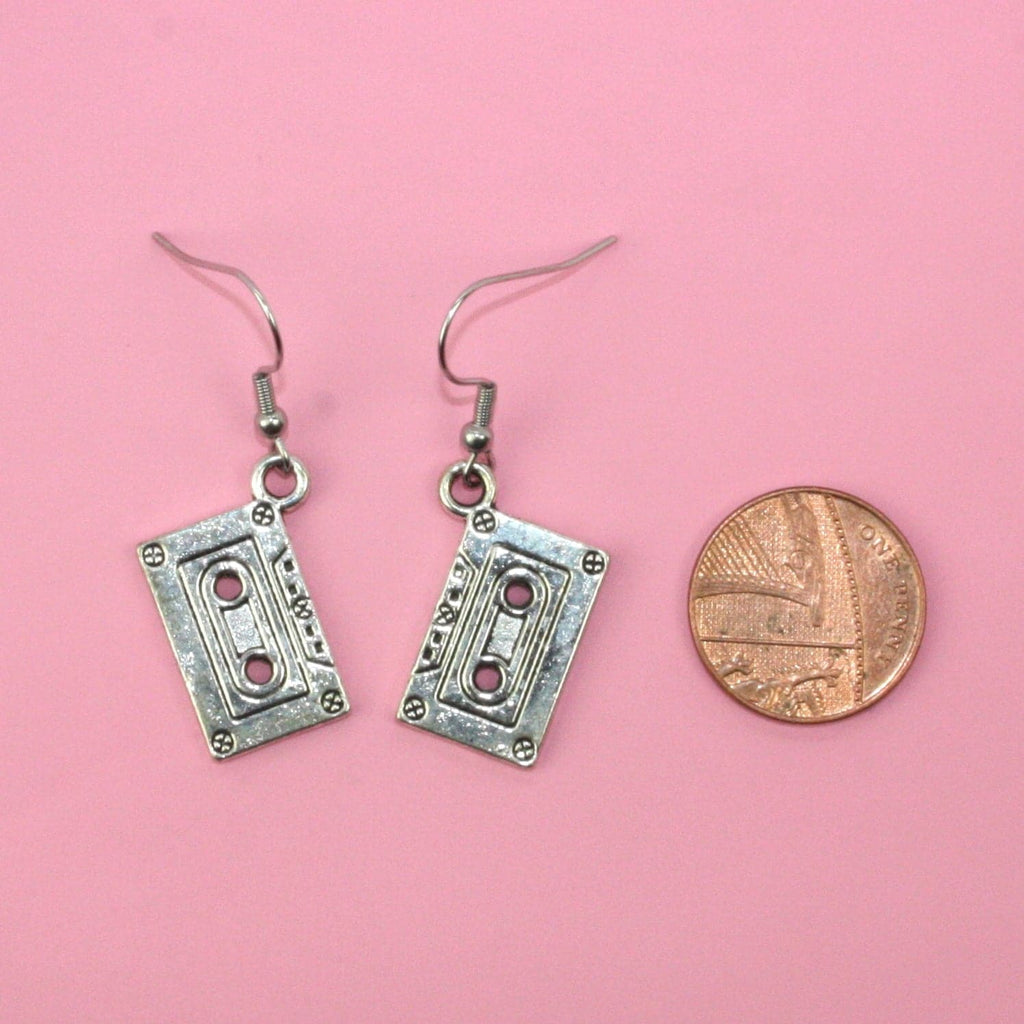 Silver plated tape charms on stainless steel earwires with a penny next to it for scale