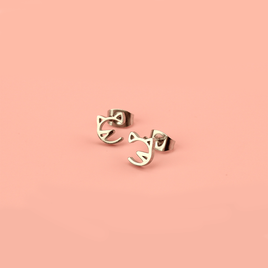 Stainless steel studs with a cut out cat face design
