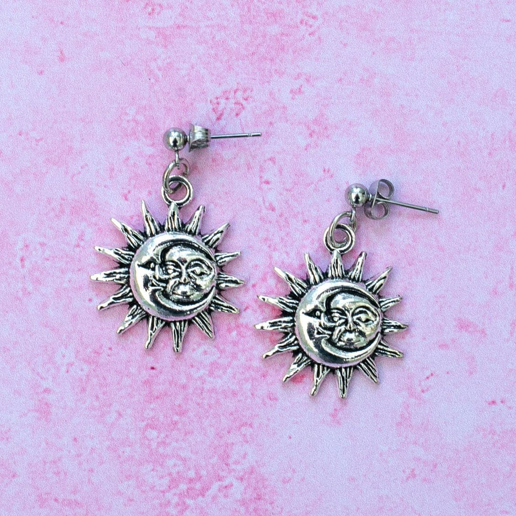 Moon and sun faces with a sun outline on stainless steeel studs
