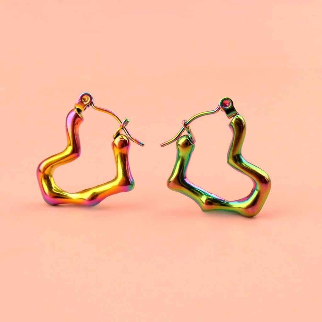 Heart shaped hoop earrings with an oil spill and a melted effect