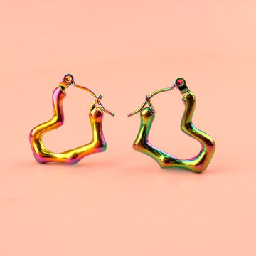 Heart shaped hoop earrings with an oil spill and a melted effect