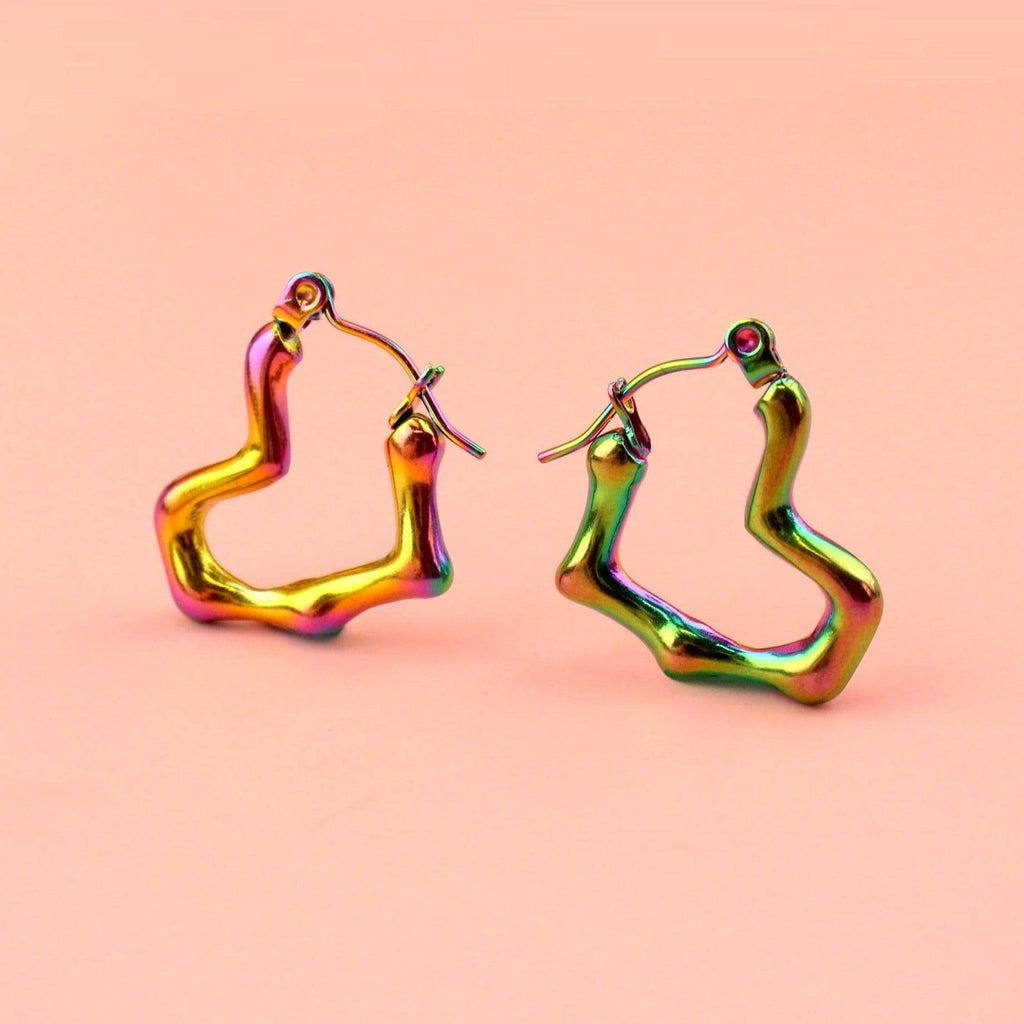 Heart shaped hoop earrings with an oil spill and a melted effect