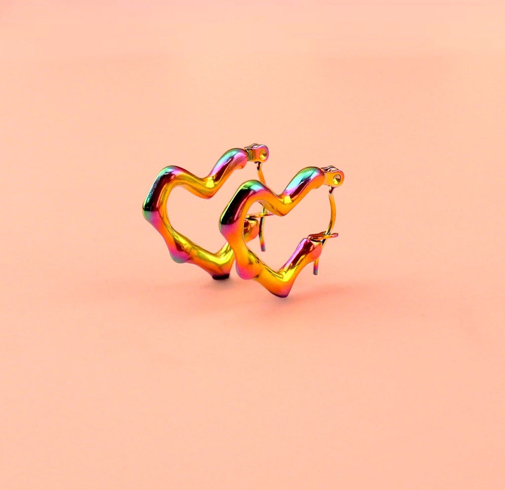 Heart shaped hoop earrings with an oil spill and a melted effect