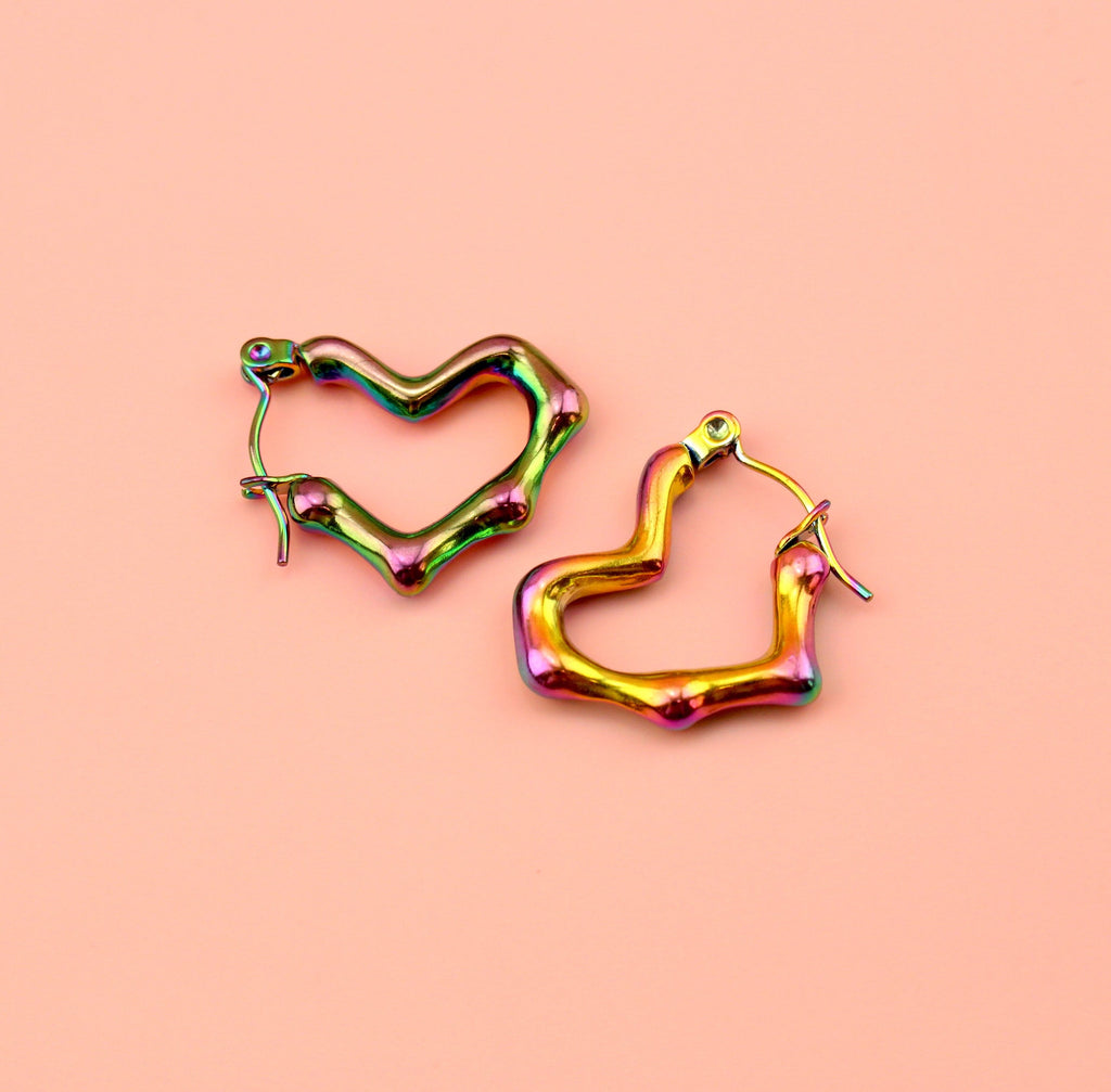 Heart shaped hoop earrings with an oil spill and a melted effect