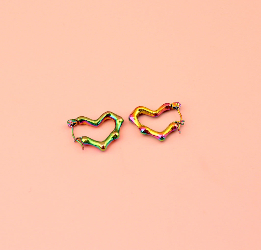 Heart shaped hoop earrings with an oil spill and a melted effect