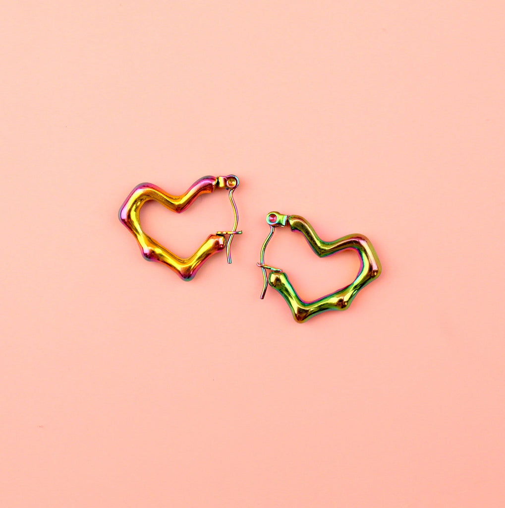 Heart shaped hoop earrings with an oil spill and a melted effect