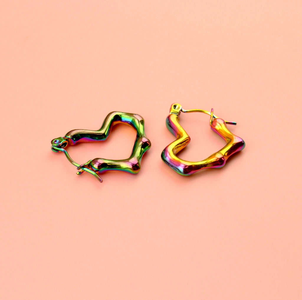 Heart shaped hoop earrings with an oil spill and a melted effect