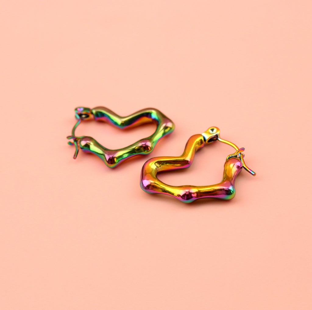 Heart shaped hoop earrings with an oil spill and a melted effect